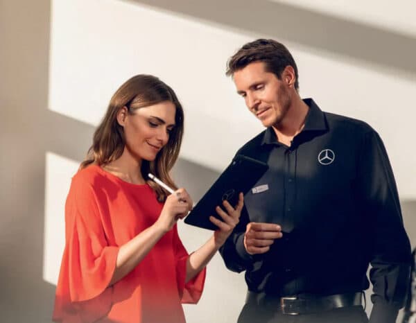 Sales consultant with customer reviewing information